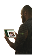 Close up of farmer's hands holding tablet with green isolated screen in wheat field